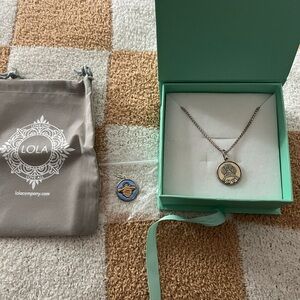 LOLA necklace in silver . Fiercely loyal Paw print & queen bee charm